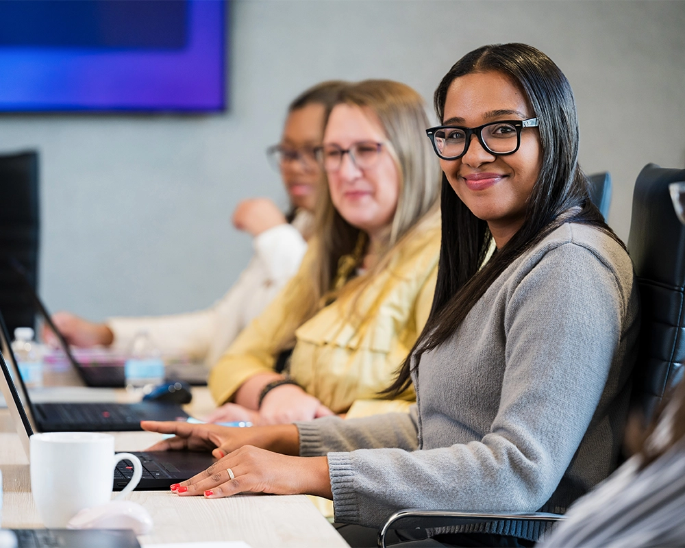 Upperline Health employee in a team meeting