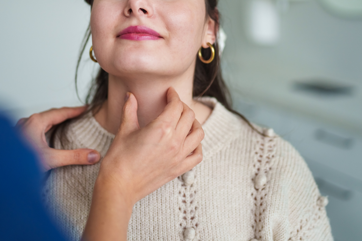 Doctor examining patient's throat